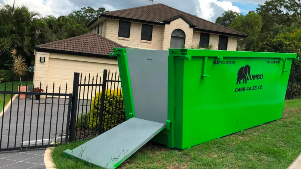 Jumbo skip bin placed on the lawn strip at a residential home.