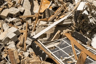 Large pile of heavy waste at a construction site after the building of a house